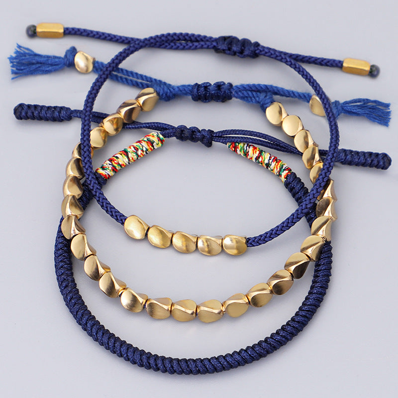 Geflochtenes Armband mit goldenen Perlen – Unisex