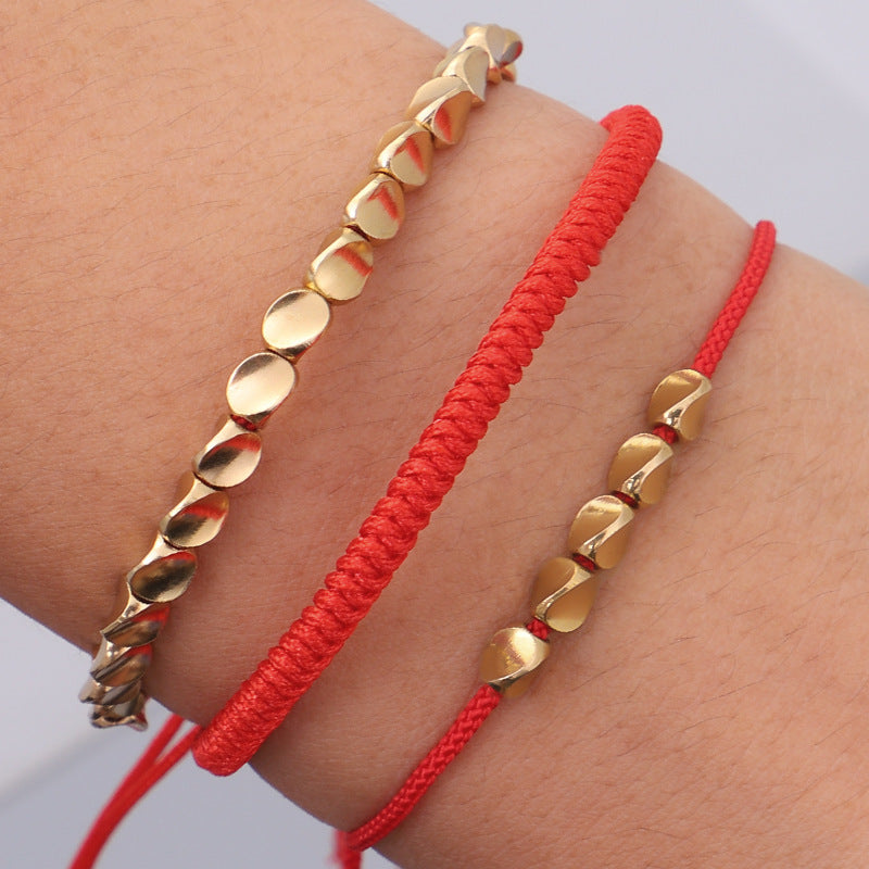 Geflochtenes Armband mit goldenen Perlen – Unisex