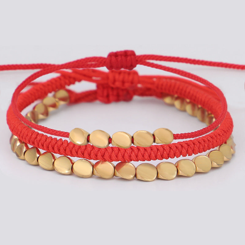 Geflochtenes Armband mit goldenen Perlen – Unisex