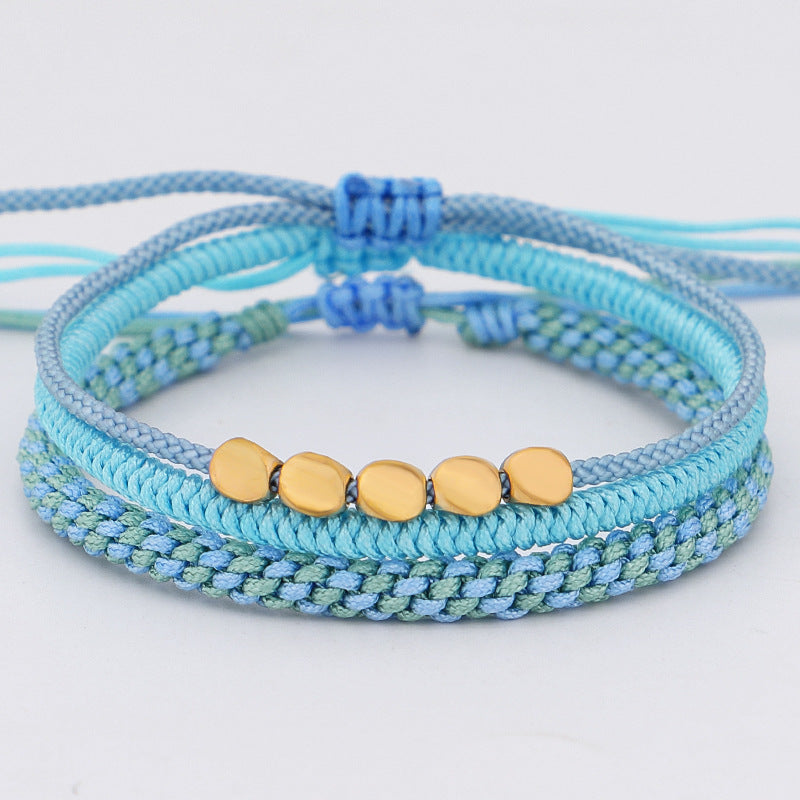 Geflochtenes Armband mit goldenen Perlen – Unisex