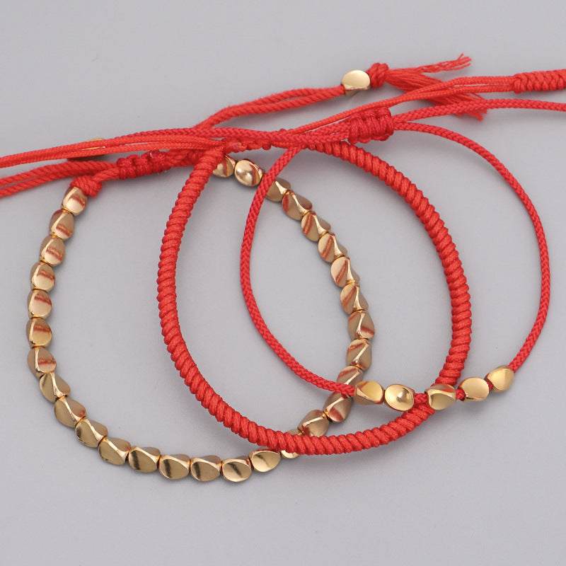 Geflochtenes Armband mit goldenen Perlen – Unisex